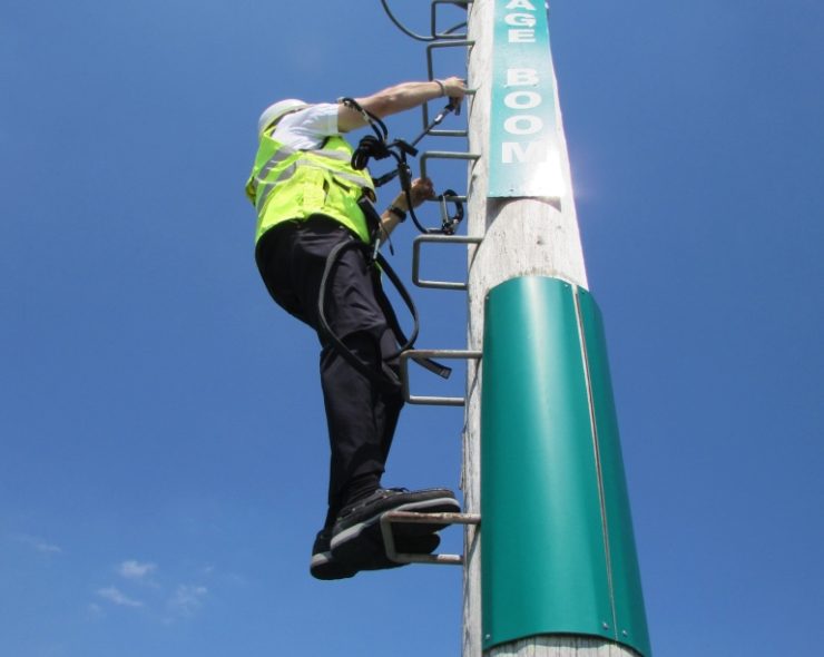 Ladder height safety training course - male wearing safety equipment