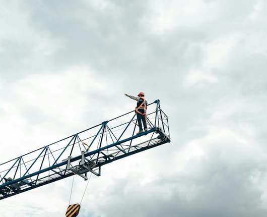 Male working at height on crane