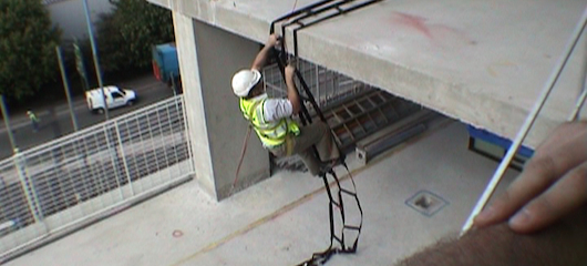 Rescue training - male climbing rescue ladder